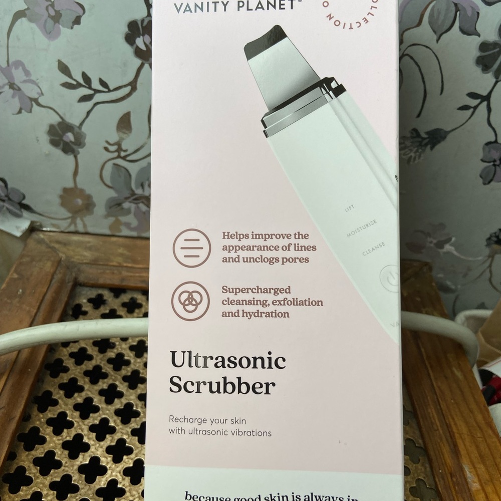 Vanity planet ultrasonic scrubber